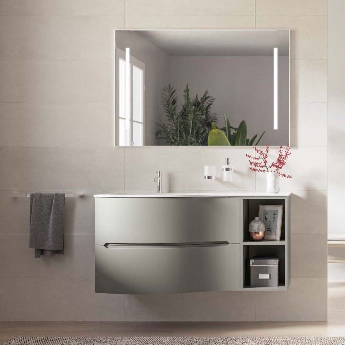 Mito 2, base sospesa semicurva con lavabo in mineralmarmo e specchiera con applique di Inda 1
